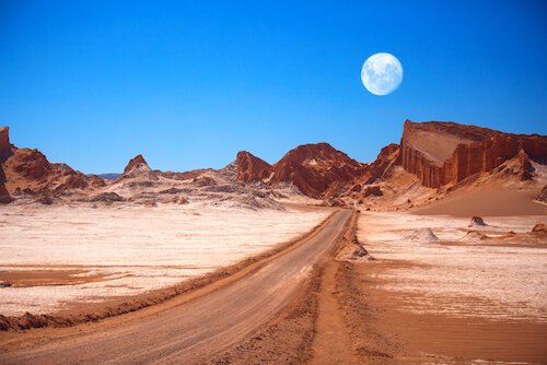 Moon over Moon valley in Atacama desert in Chile